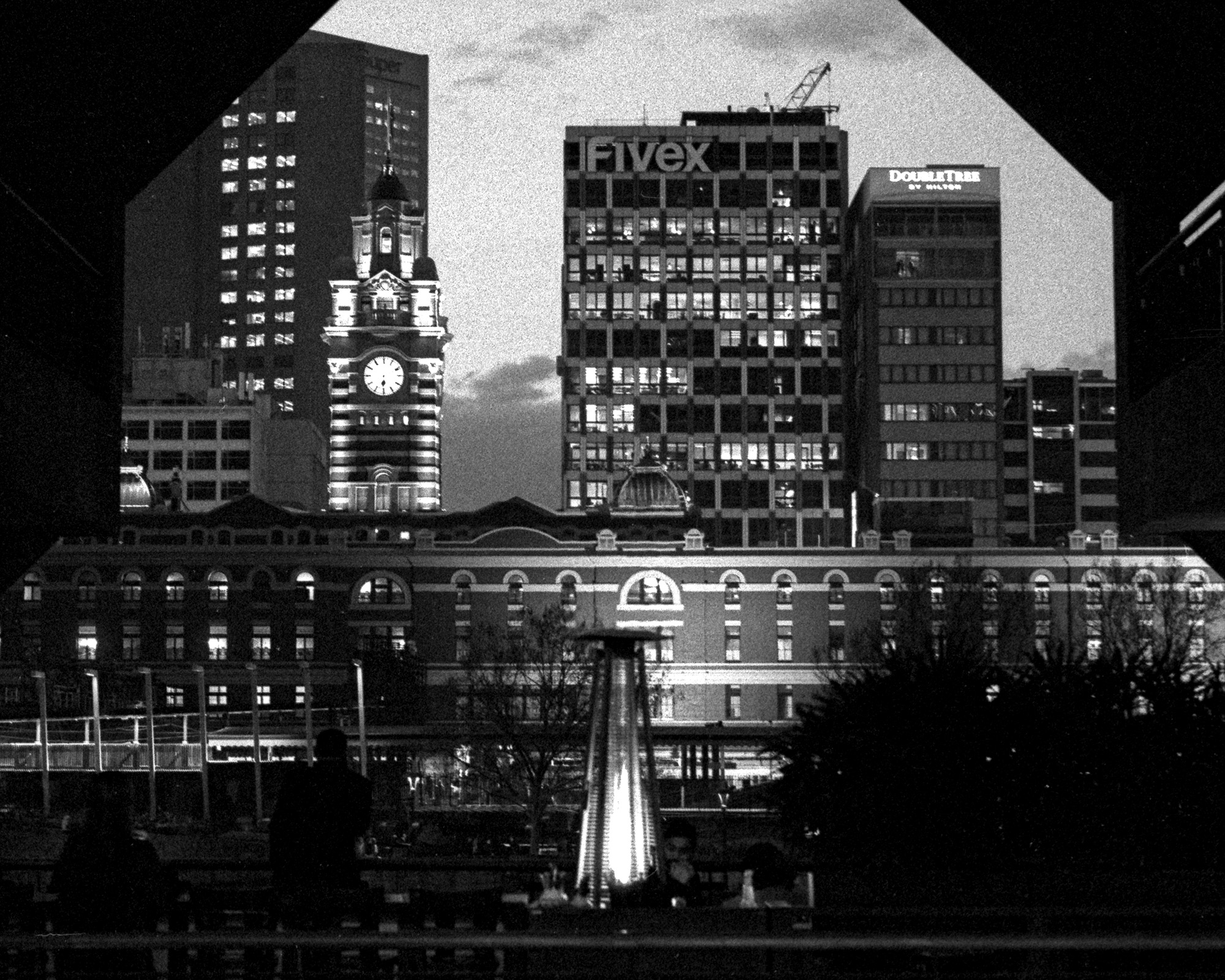 Flinders Street Station at night, in black and white